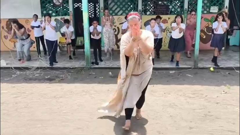 Adriana dancing Gaia Namaskar with the children of the Barra del Tortuguero School in Costa Rica